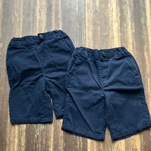 Two pairs of navy uniform shorts